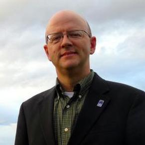 Speaker at Mayo Dark Sky Festival against cloudy sky backdrop