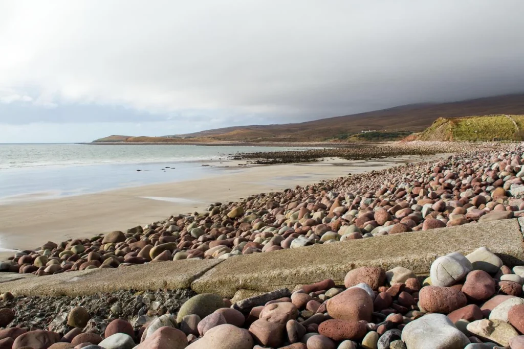 Rocky beach landscape under cloudy skies in County Mayo, Ireland, ideal for dark sky stargazing and astronomy events.